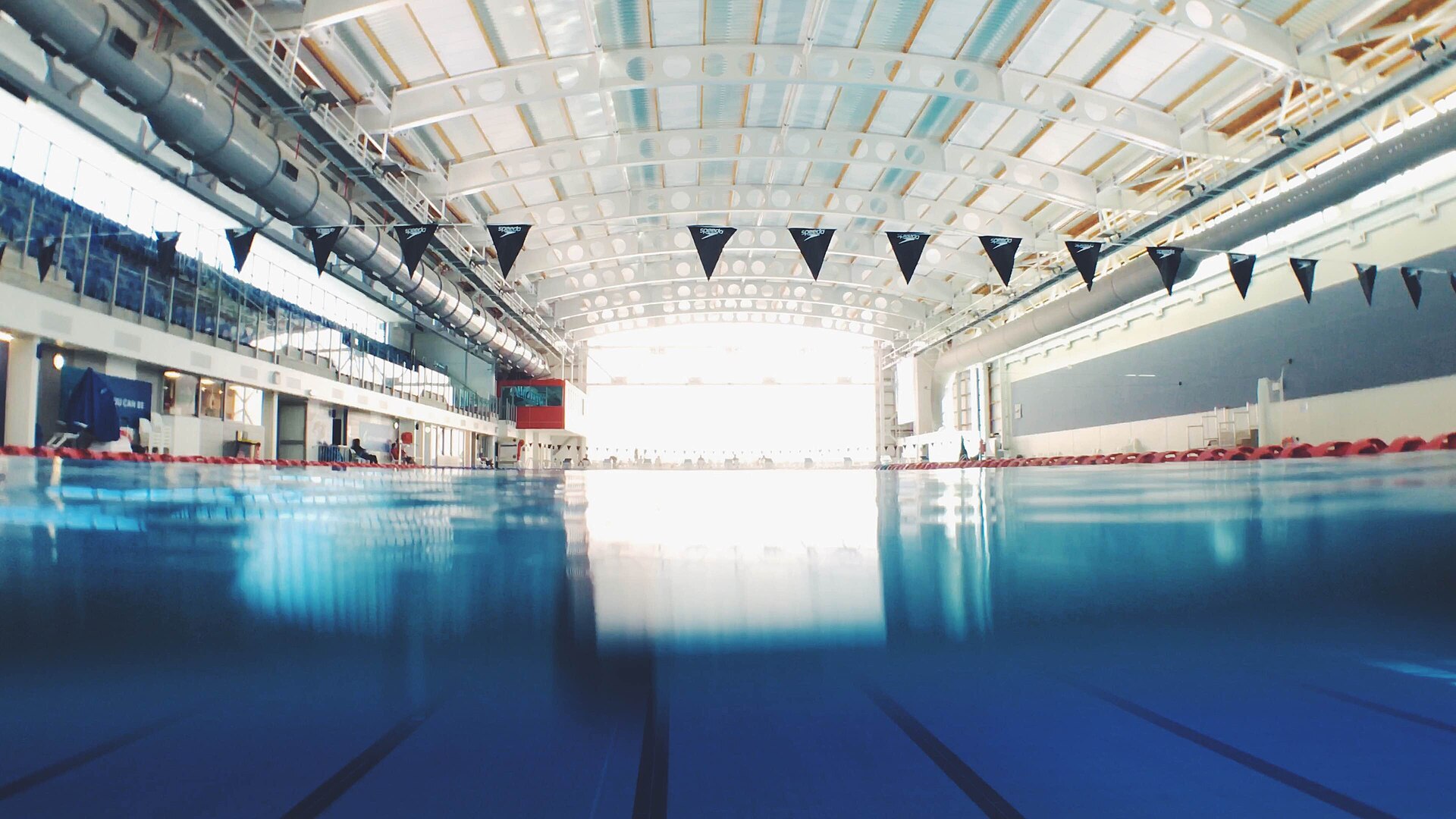 Quiet indoor swimming lanes seen across the surface of the pool
