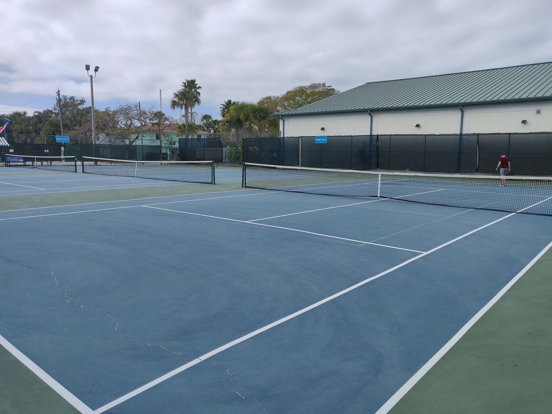 Green community tennis courts in warm afternoon light